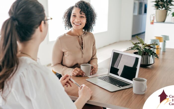 A woman interviews for a job position representing one of the steps during which a caregiver should be evaluating if an agency is a good fit.